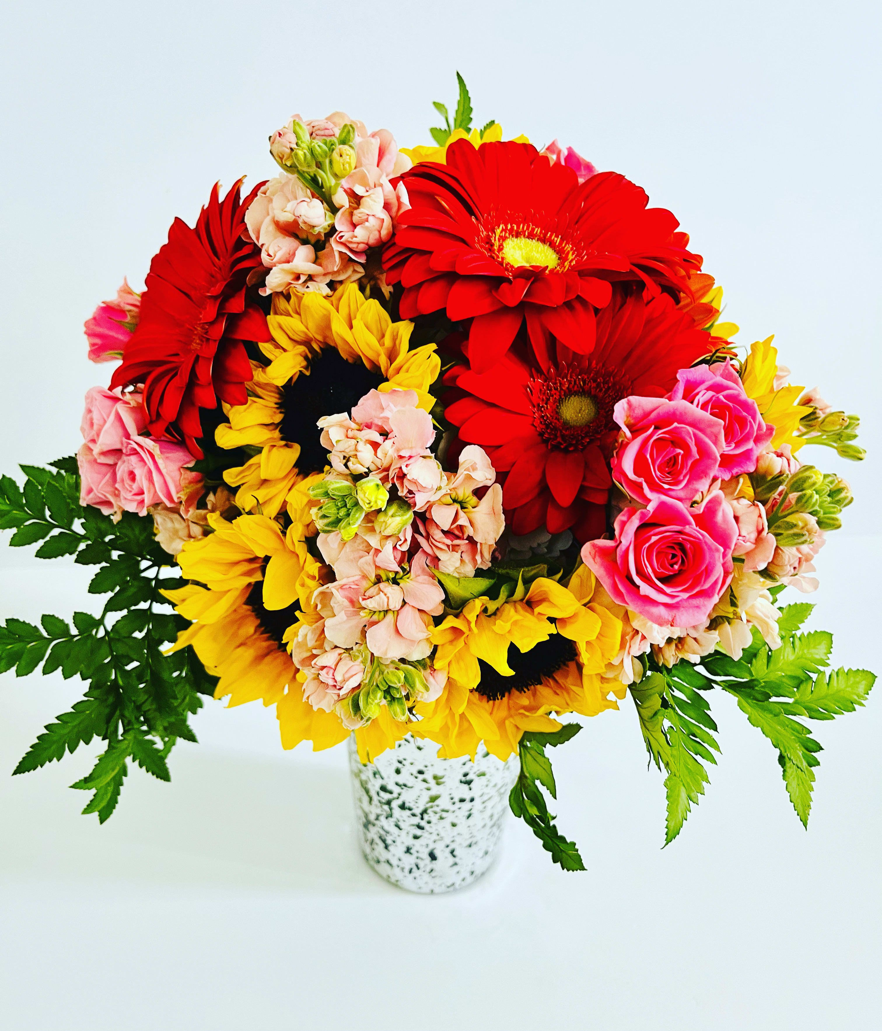 The everyday bouquet - A designer choice arrangement designed with colorful seasonal blooms, based on availability.  Designed to be viewed from all angles.  Enhanced option includes additional blooms and foliage.  All floral arrangments are designed to a style and use seasonal materials of varying content.  Please contact us directly for any custom orders or requests info@helemelebotanicals.com or 808.226.7667  We are committed to malama 'aina and strive to use locally sourced material, reduce packaging and reuse and recycle where possible. We will pick up any of our product (vessels, plants and floral supply material) when delivering a subsequent order. At that time, a $5 credit toward future purchase will be issued for each ceramic, metal or wood vessel returned.