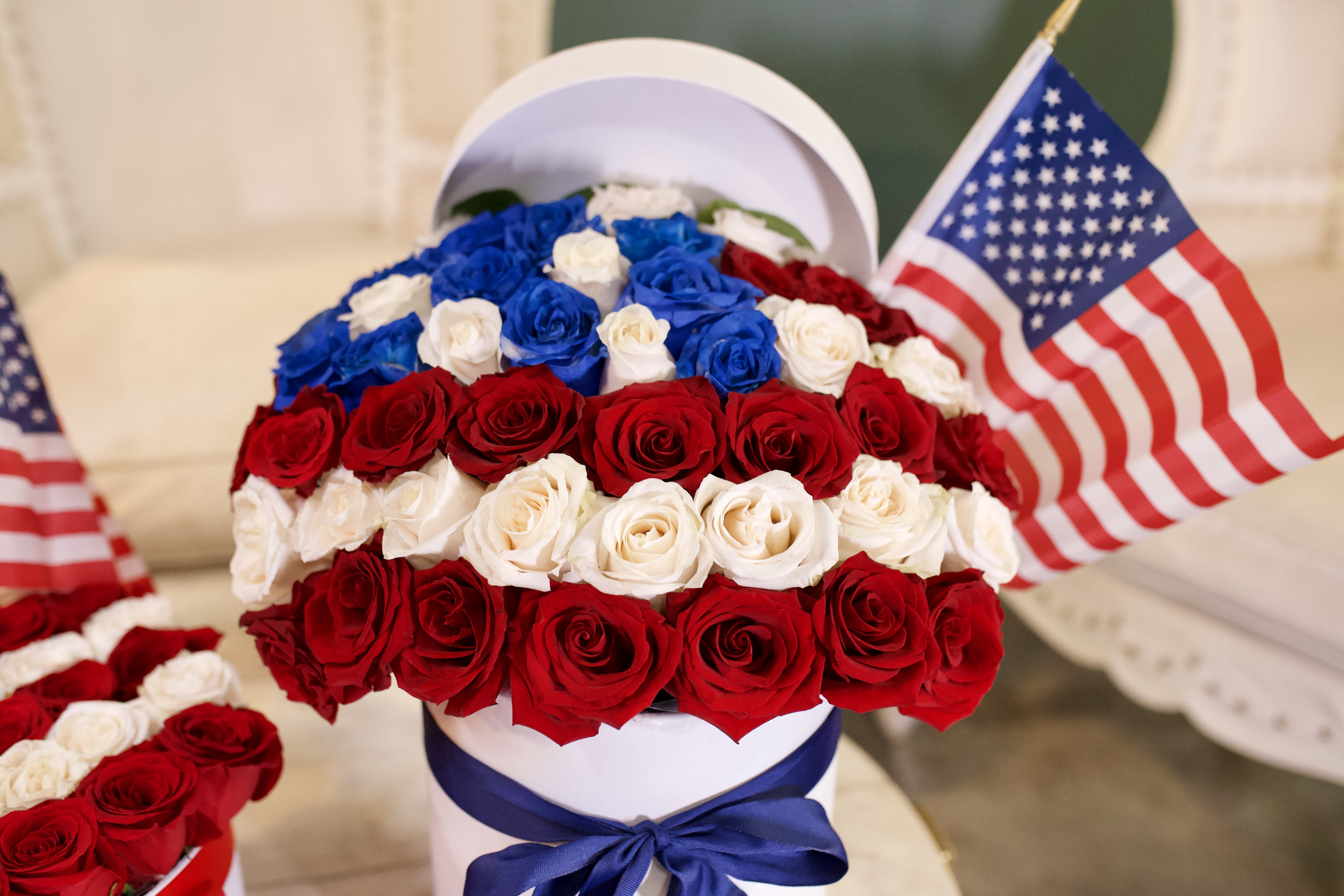 Memorial Day Red, White and Blue Bouquet (Large) - Made with 30 roses, the Memorial Day large bouquet comes in red, white, and blue roses with a blue ribbon and pearl white french hat box.