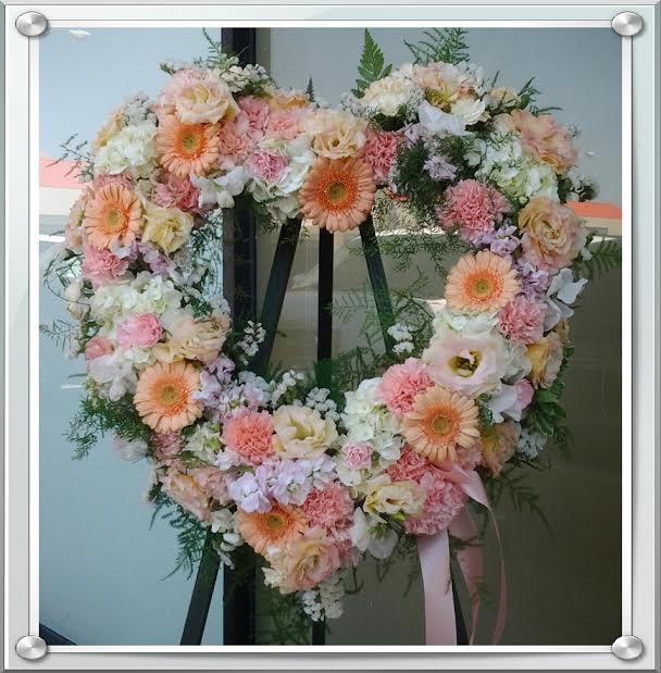 Soft Blush Wreath Soft Blush Wreath - A beautiful heart shaped wreath in soft peach and pink tones.