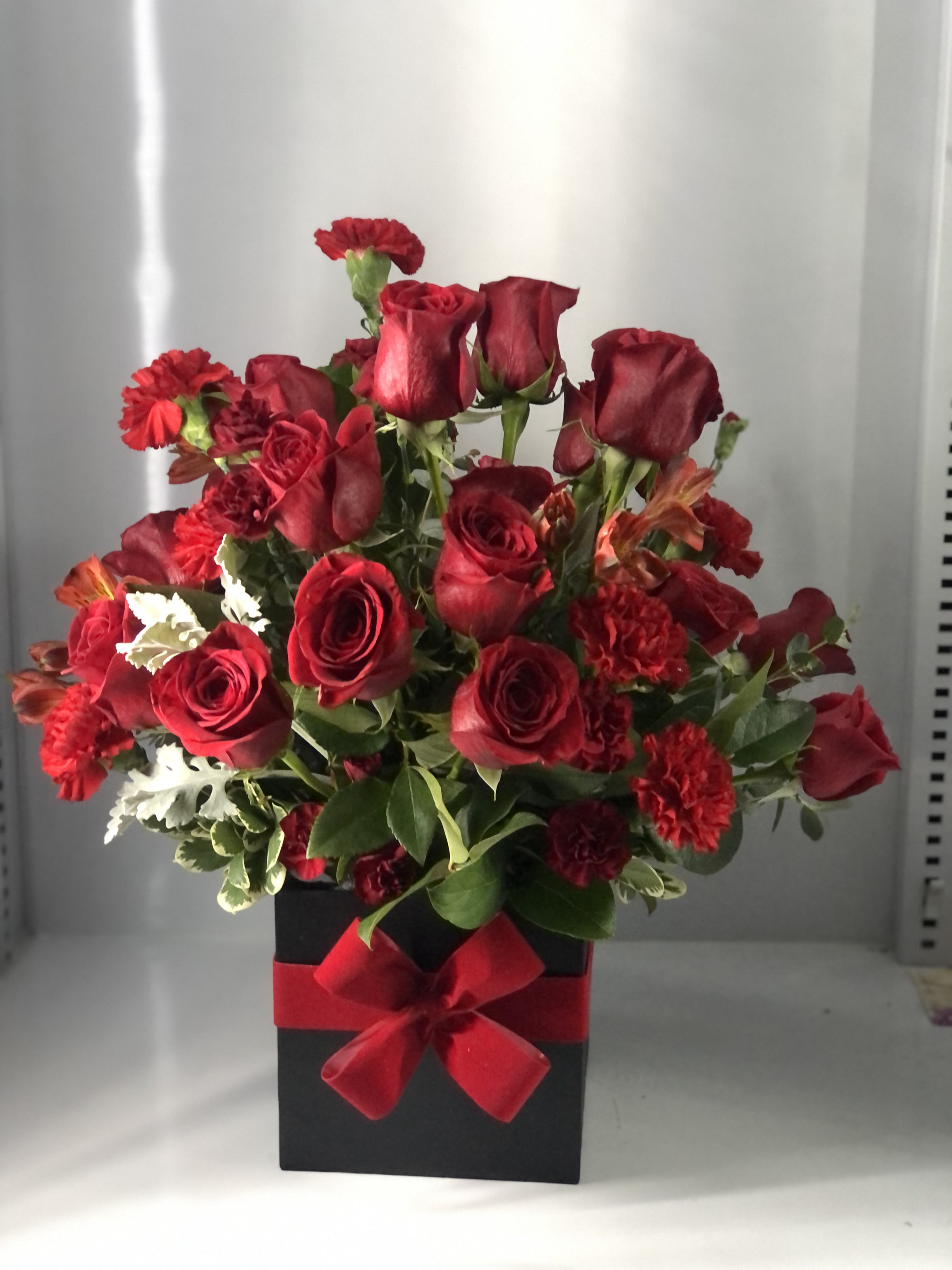 Express your true love with these all red blooms - This beautiful all red blooms starts about 10x10  the one pictured it’s the deluxe