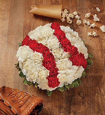 MVP Baseball Collection for Father's Day MVP Baseball Collection for Father's Day - Looking to score points with the sports lover in your life? Send one of our truly original floral creations expertly crafted in the shape of a baseball. It’s a fresh, fun surprise that’ll have them feeling like they’re #1! Our florists hand-design each creation, so colors and varieties may vary due to local availability Gathering of fresh flowers in the shape of a baseball (white carnations, red mini carnations, and variegated pittosporum)