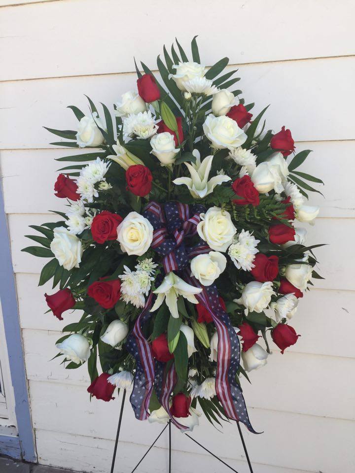 Polly's Memorial Polly's Memorial - Standing Easel Spray Of Red and White roses, White Lilies and Pom poms to fill With A Patriotic Ribbon accent