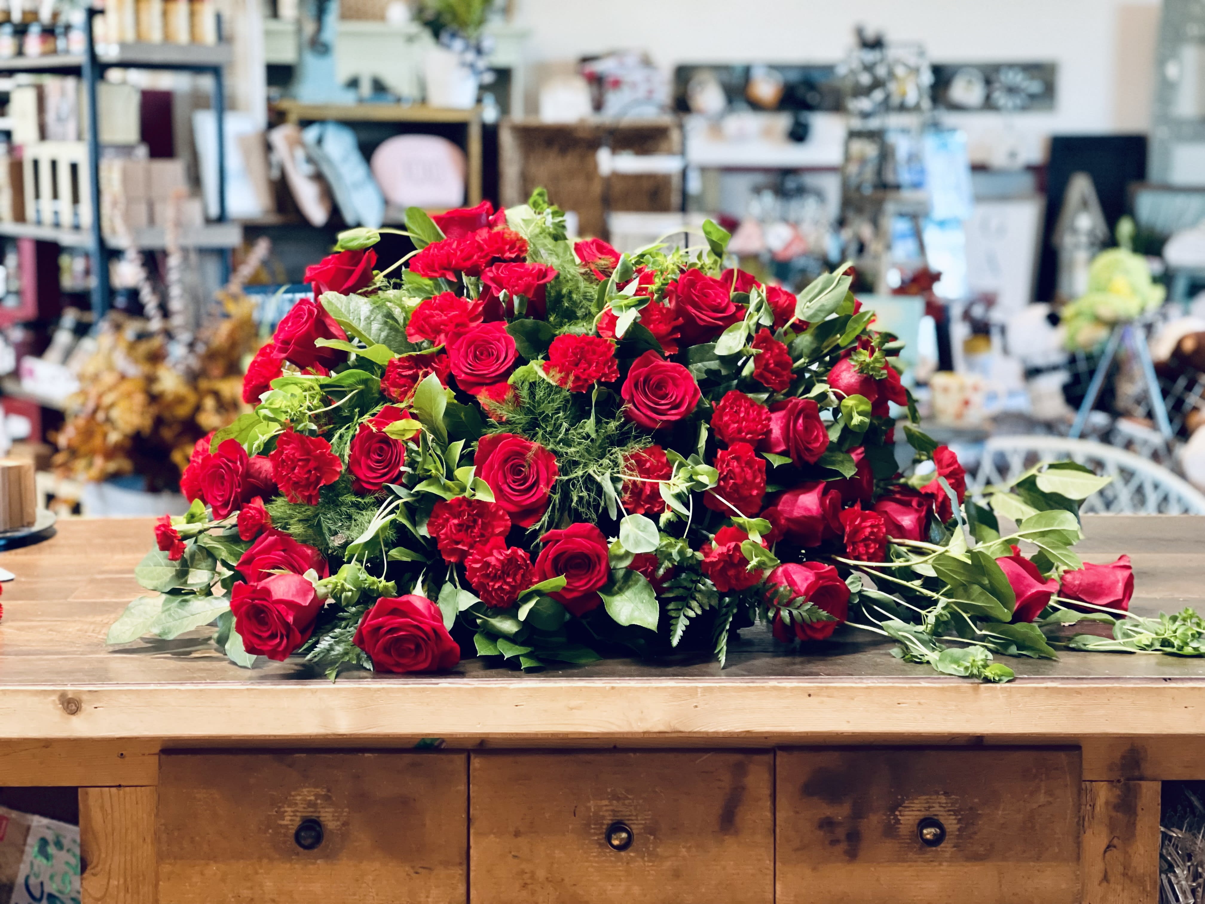 Red Rose Caskey Spray Red Rose Caskey Spray - Lovely Greens with all Red Rose casket spray for that special loved one.