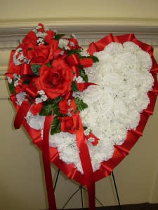 BLEEDING HEART, LARGE  SILK PERMANENT                 NEW-S05 - OUR SILK BLEEDING HEART IS MAKE OF QUALITY SILK-PERMANENT WHITE CARNATIONS WITH A CASCADING SPRAY OF RED ROSES FLOWING DOWN FROM THE CENTER OF THE HEART WITH RED RIBBON AND COMES ON A TALL EASEL STAND.  THE HEART IS 24&quot; WIDE AND 30&quot;TALL AND STANDS AN IMPRESSIVE 50&quot;TALL ON THE EASEL. OUR SILK PERMANENT  SYMPATHY FLOWERS ARE AN ECONOMICAL ALTERNATIVE TO LIVE FRESH FLOWERS  AND ALSO GREAT FOR THOSE LAST MINUTE FUNERAL ORDERS WHEN THERE IS NOT ENOUGH TIME TO CREATE A FRESH FLOWER DESIGN.. MOST ALL OF OUR LOCAL CEMETERIES ALLOW SILK AND PERMANENT FLOWERS TO REMAIN ON THE GRAVE FOR QUITE SOME MONTHS AND ARE VERY PRACTICAL DURING THE FREEZING WINTER MONTHS OR THE EXTREMELY HOT SUMMER MONTHS IN OUR AREA. 