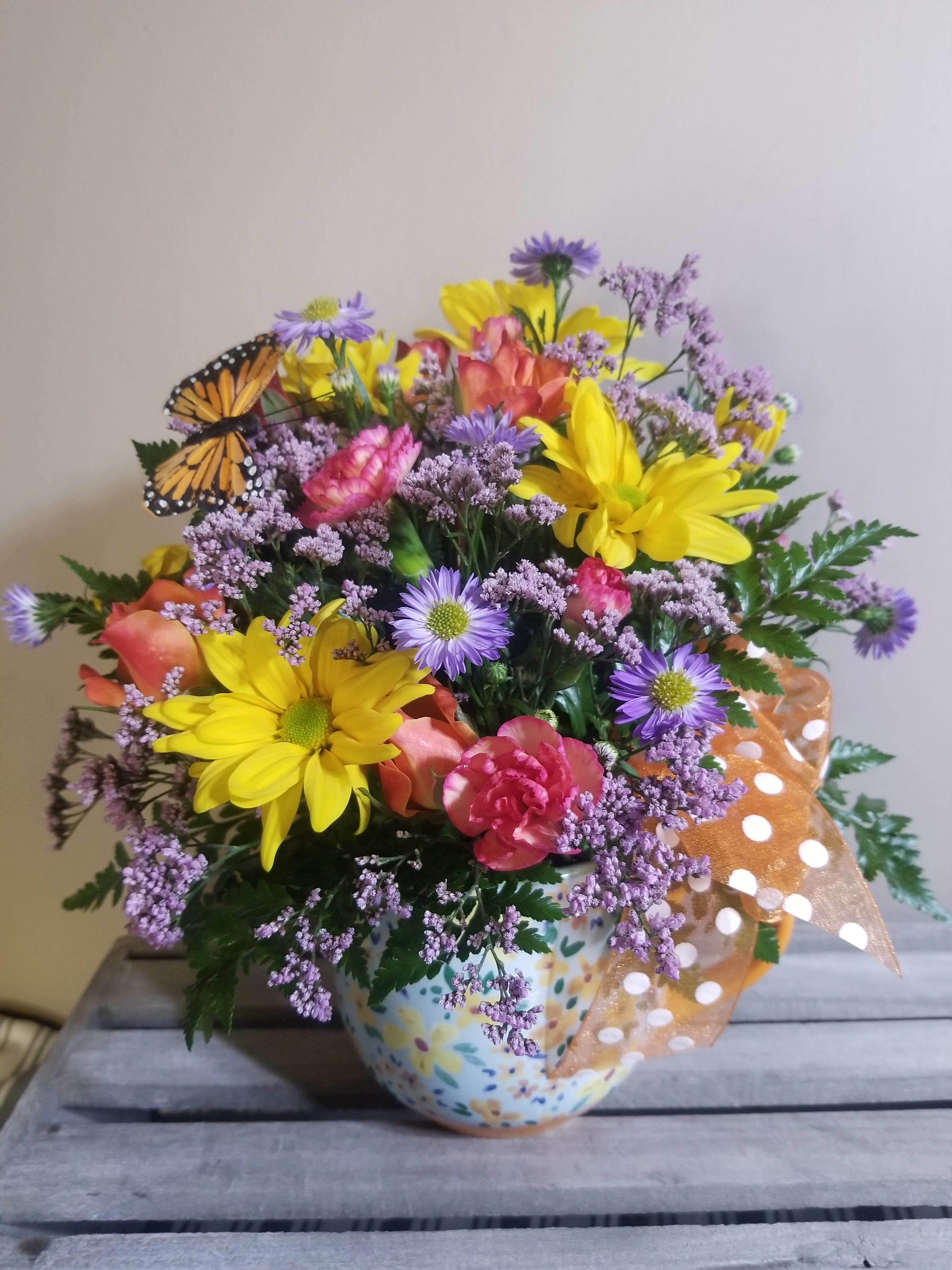 A Beautiful Day in the Neighborhood A Beautiful Day in the Neighborhood - This beautiful arrangement is perfect to liven up someone's day! It includes dasieys, carnations, and seasonal blooms.