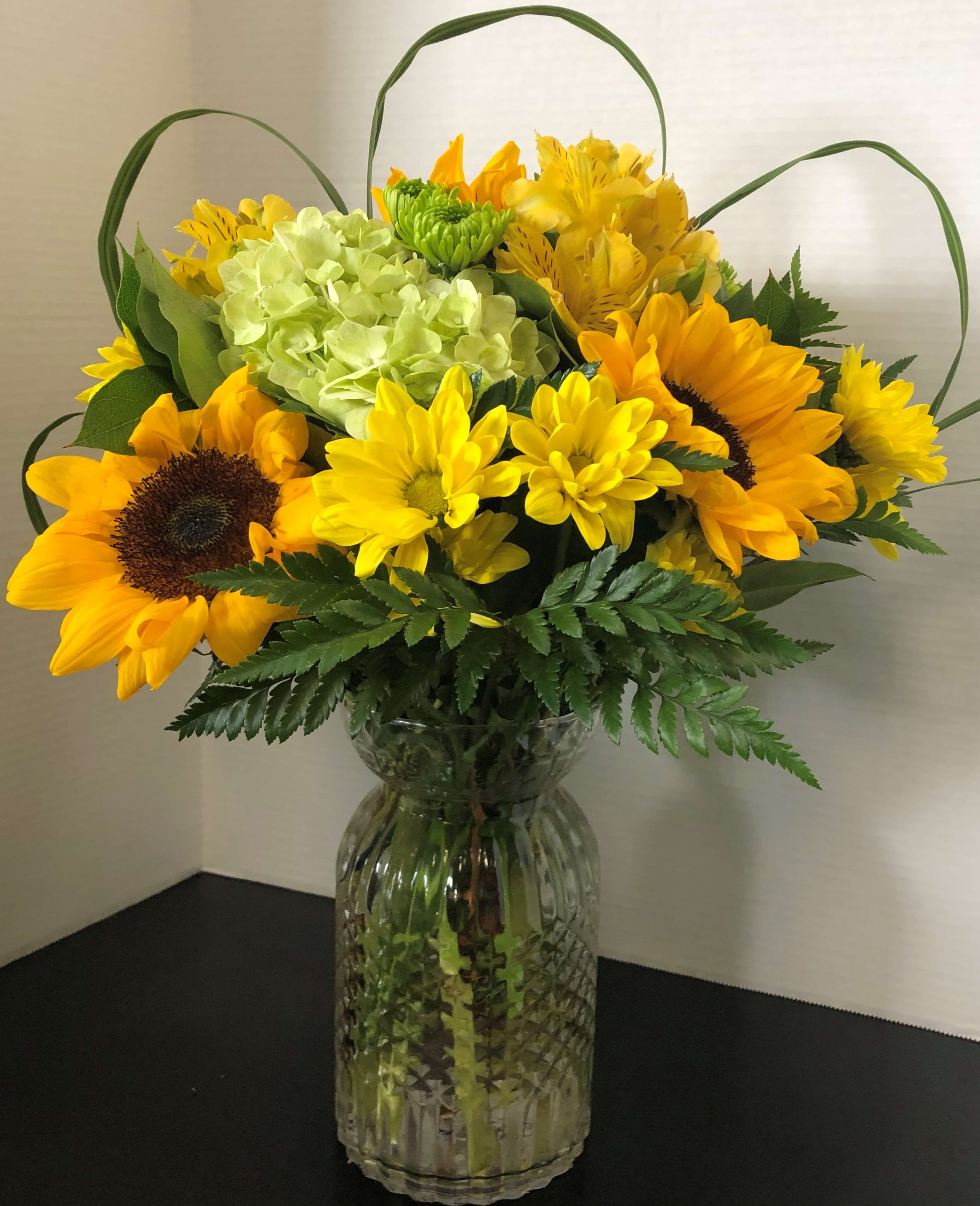 Sunflower's, Hydrangeas and Greens Sunflower's, Hydrangeas and Greens - Bright sunflowers with daisies and Hydrangeas to brighten your day
