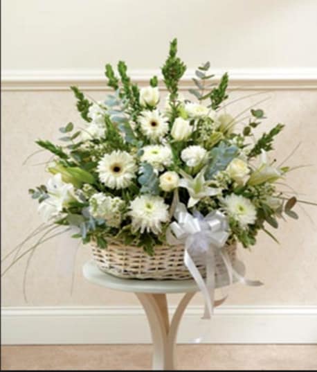 WICKER BASKET OF WHITE WICKER BASKET OF WHITE - MIXED WHITE FLOWERS IN A WHITE WASHED WICKER BASKET