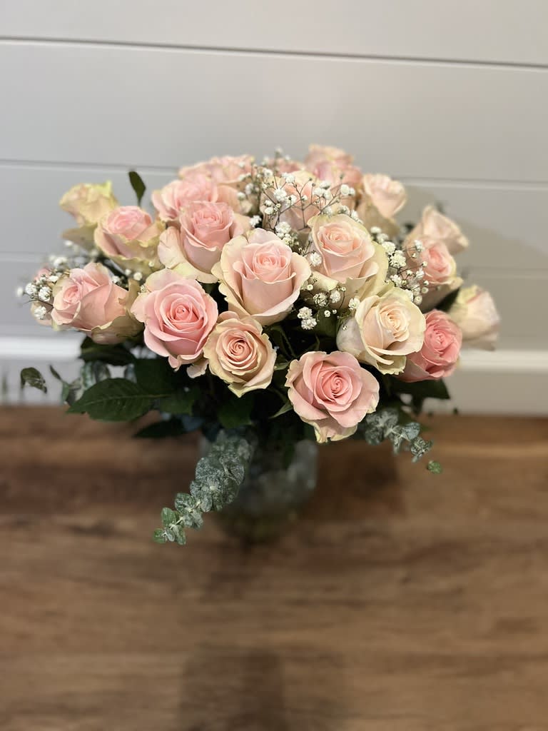 2 dozen roses - What's more exciting than a dozen roses? TWO dozen roses! Beautifully arranged in a clear vase with a little greenery and some baby's breath, trust me, these will make. her. day!!