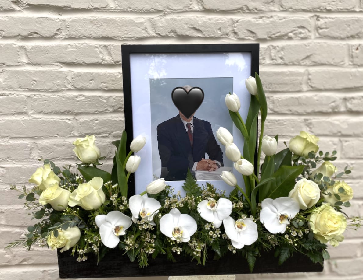 Sympathy Box Photo Tribute - Surround a beloved picture with this elegant arrangement of orchids, roses and tulips. The colors of the flowers in this arrangement can be changed  and candles can be added, upon request. 