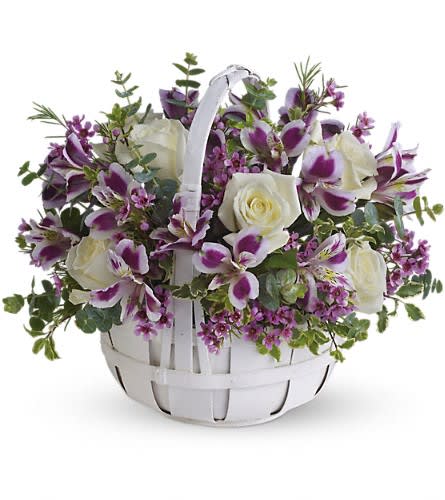 Sweet Moments - Know someone who needs a lift? Brighten their day by sending this lovely bouquet of fresh flowers that has sweetness woven right in. Gorgeous white roses purple alstroemeria lavender waxflower and eucalyptus are perfectly arranged in a white basket. Perfectly sweet!Approximately 14 1/2&quot; W x 12 1/2&quot; H Orientation: All-Around As Shown : T68-2ADeluxe : T68-2BPremium : T68-2C