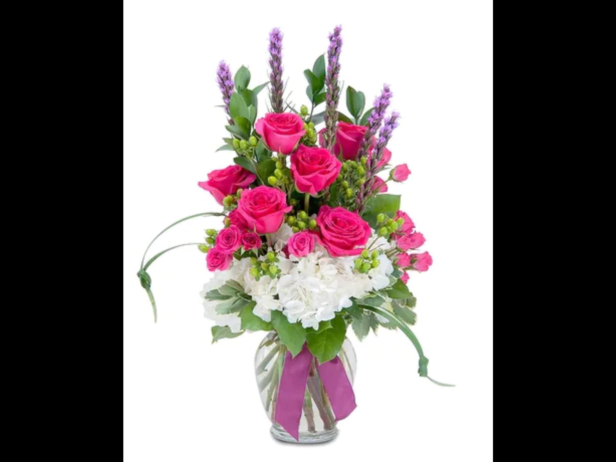 A New Start - Hot pink roses take charge over this beautiful medium tall arrangement 