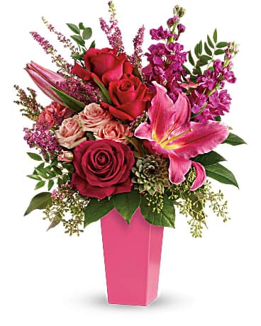Forever Fuchsia Bouquet - Pretty in pink! A surprise they'll remember forever, this fantasy of fuchsia lilies, roses and carnations is artistically arranged in a sleek contemporary vase. This stunning bouquet features pink oriental lilies, hot pink roses, pink carnations, fuchsia stock, light pink spray roses, pink heather, lemon leaf, huckleberry, seeded eucalyptus, and a small green potted echeveria succulent. Delivered in a raspberry tapered vase.