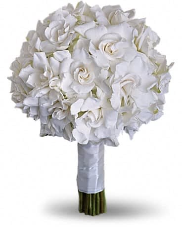 Gardenia and Grace Bouquet - Beloved for their enchanting fragrance, gardenias are gathered with hydrangea and roses into an elegant white bouquet. Gardenias and hydrangea are paired for a stunning all-white bouquet.