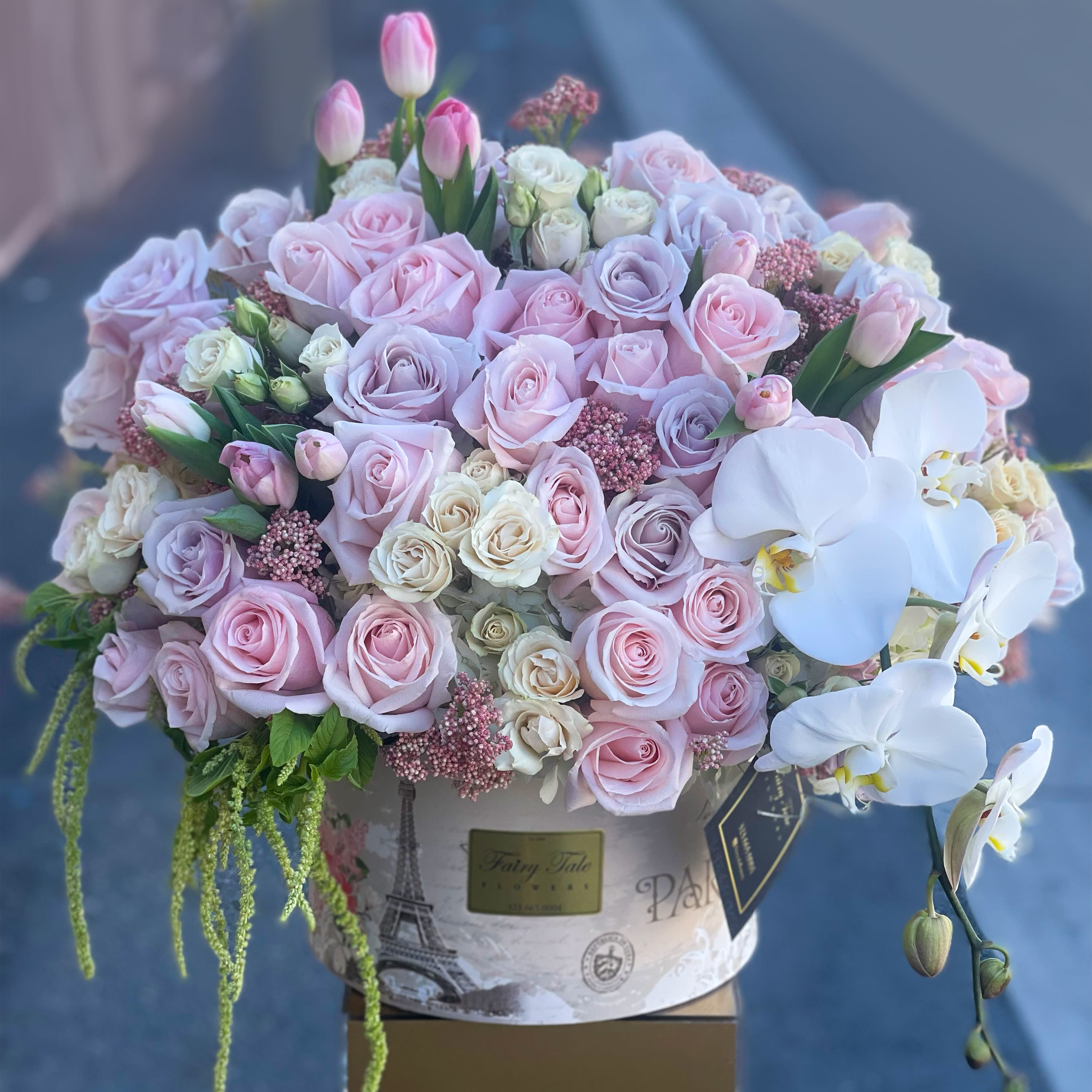 European Love - Romantic arrangement with lavender and pink roses, tulips, large orchid and spray roses