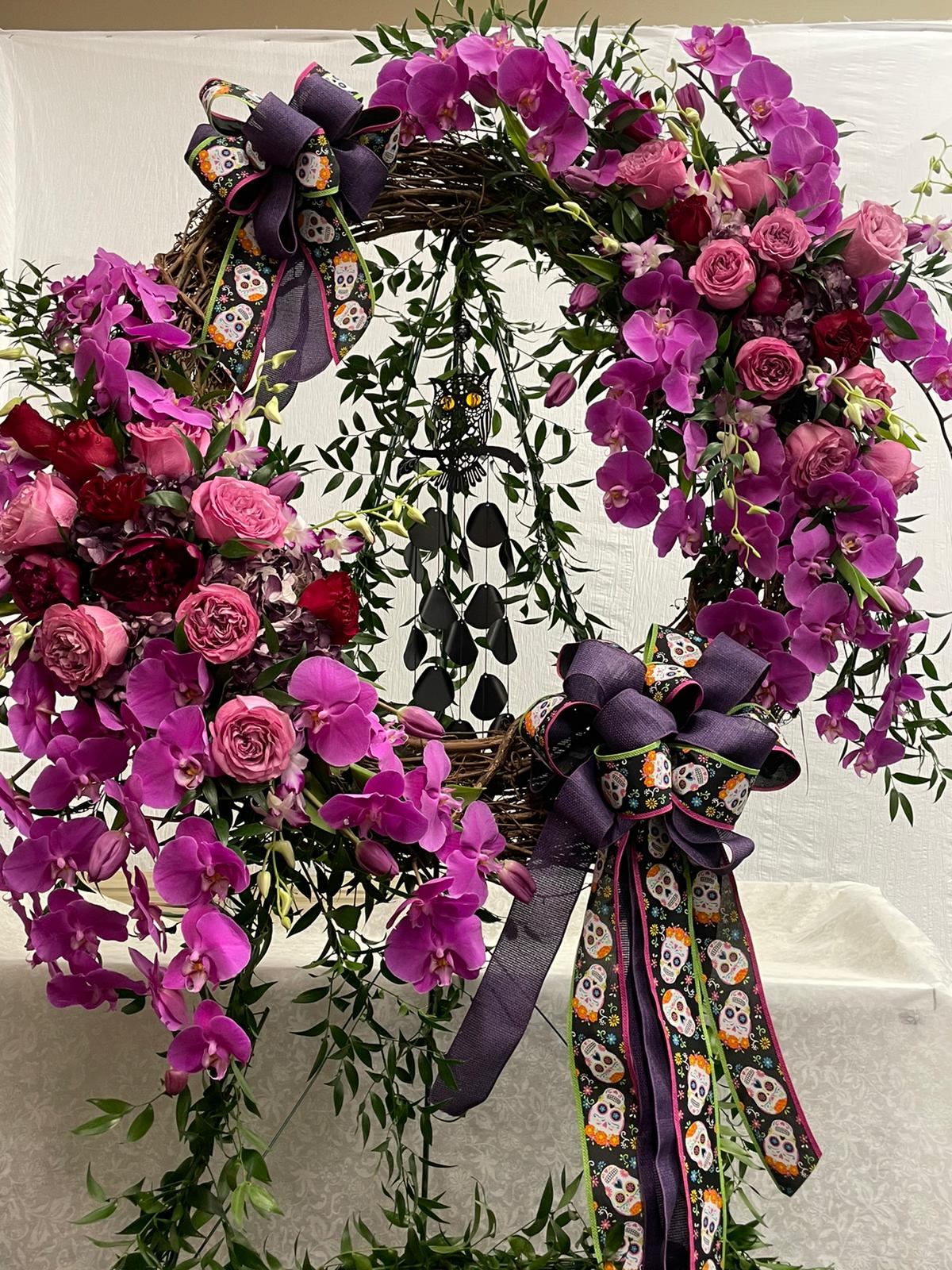 Custom Wreath Custom Wreath - This Grapevine Wreath can be customized with a special theme to capture a loved one's special interests. Ribbon and chime would be provided by customer.
