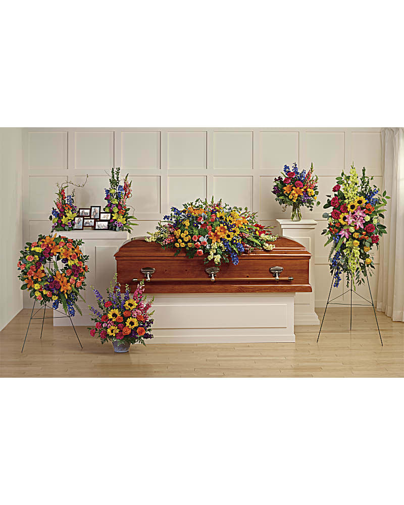 Colorful Reflections Collection - Celebrate the beautiful colors of your beloved memories with this rainbow-inspired collection, featuring six hand-made sympathy pieces that are both radiant and reverent. Teleflora's Colorful Reflections Collection includes the following six sympathy set pieces: Colorful Reflections Casket Spray, Love Lives On Spray, Colorful Serenity Wreath, Teleflora's Hues Of Hope Bouquet DX, Loving Farewell Photo Tribute Bouquet DX, Colors Of The Rainbow Bouquet DX