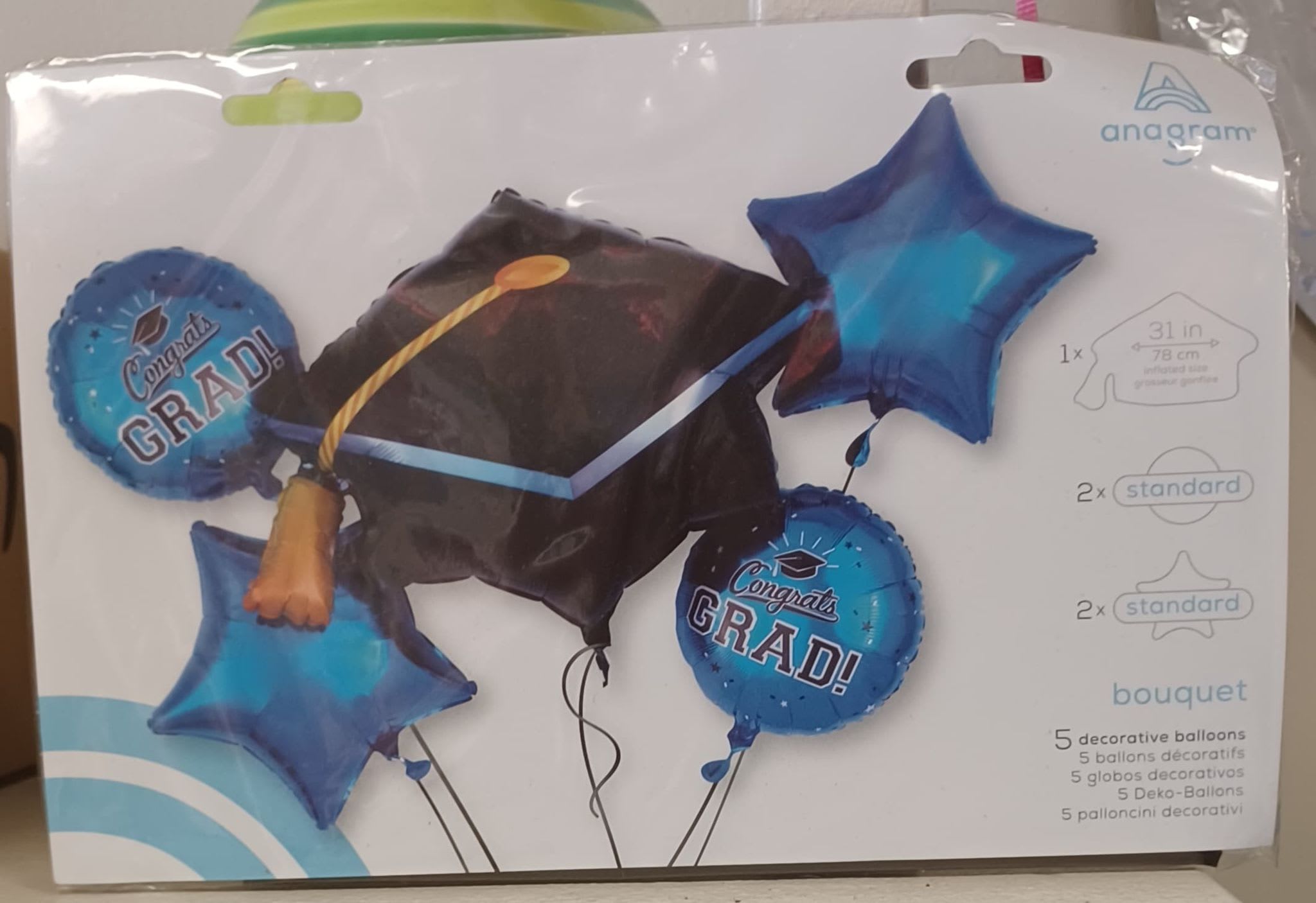 Blue and Black Graduation Balloon Bouquet - Each bouquet has- 1- 31in Cap Mylar Balloon 2- Blue 18in Round Mylars 2- Blue Star Mylars All tied to a festive weight to match