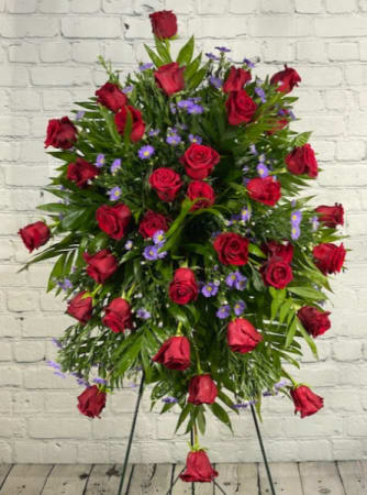 Royal Reflection - Royal reflection is a standing spray featuring two dozen red roses accented by regal purple aster.