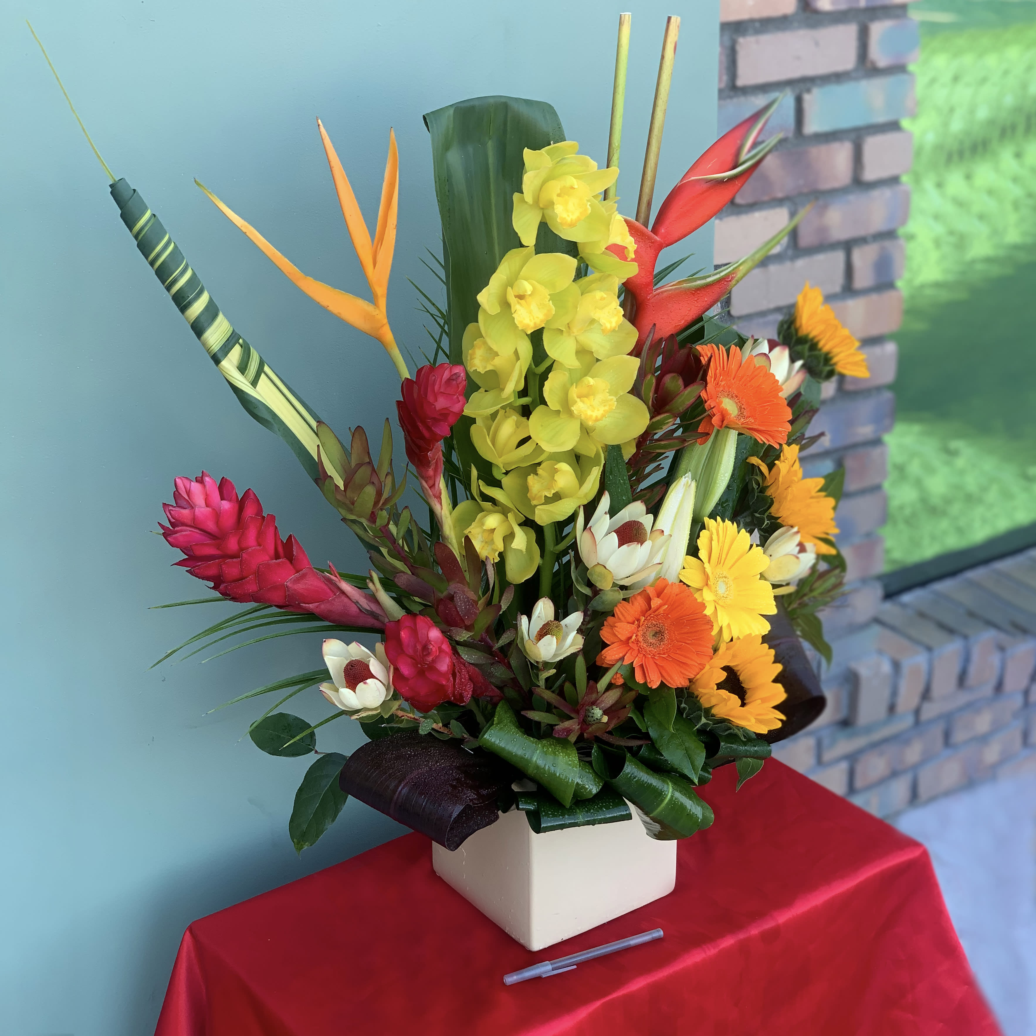 Hawaiian Sunset - Feel the Tropical freshness with the Hawaiian Sunset arrangement  Approximate Dimensions: 20&quot;H X 18&quot;W