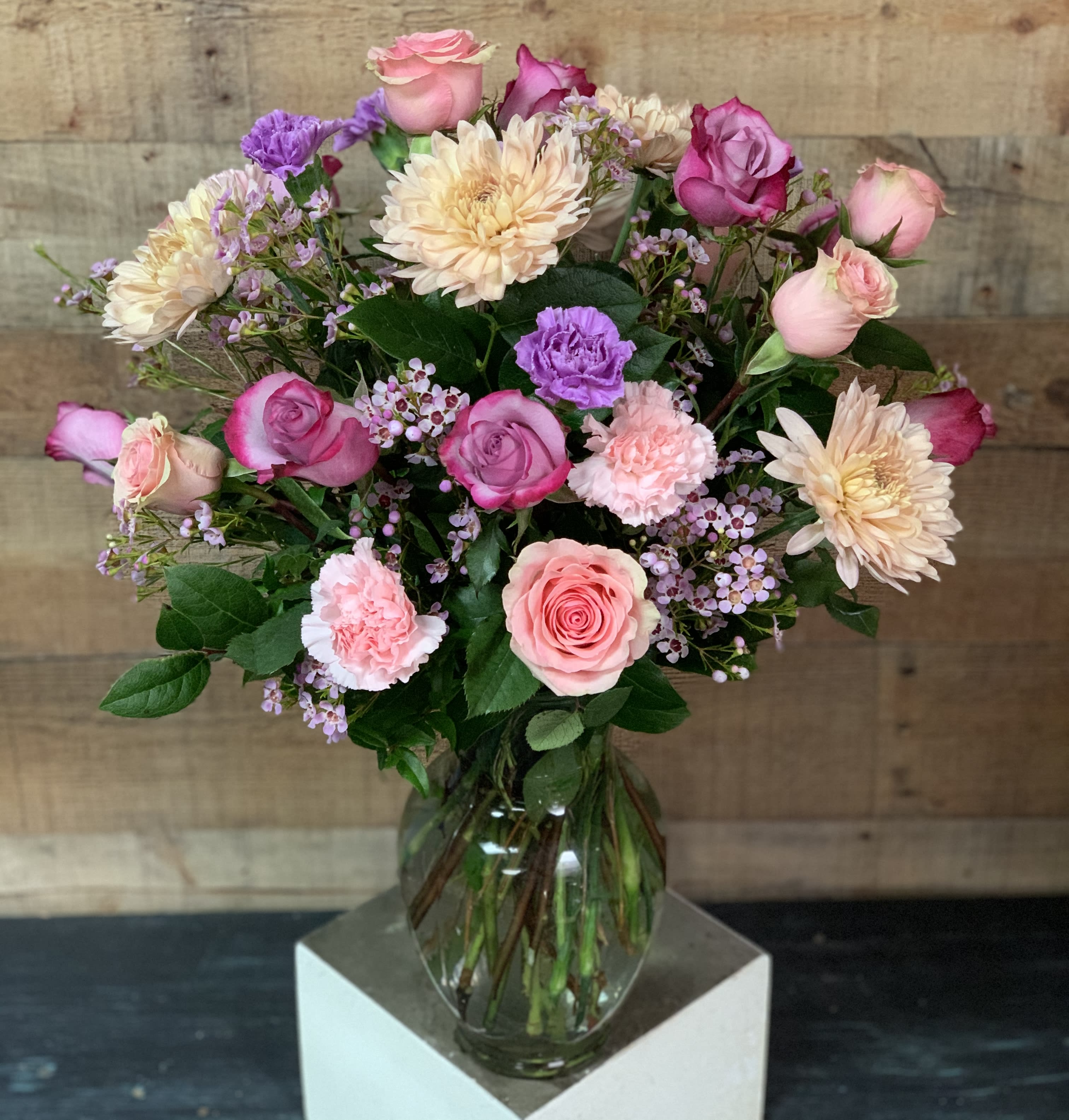 Lovely Blooms - A lovely arrangement of soft colored blooms including roses, carnations, and cremones