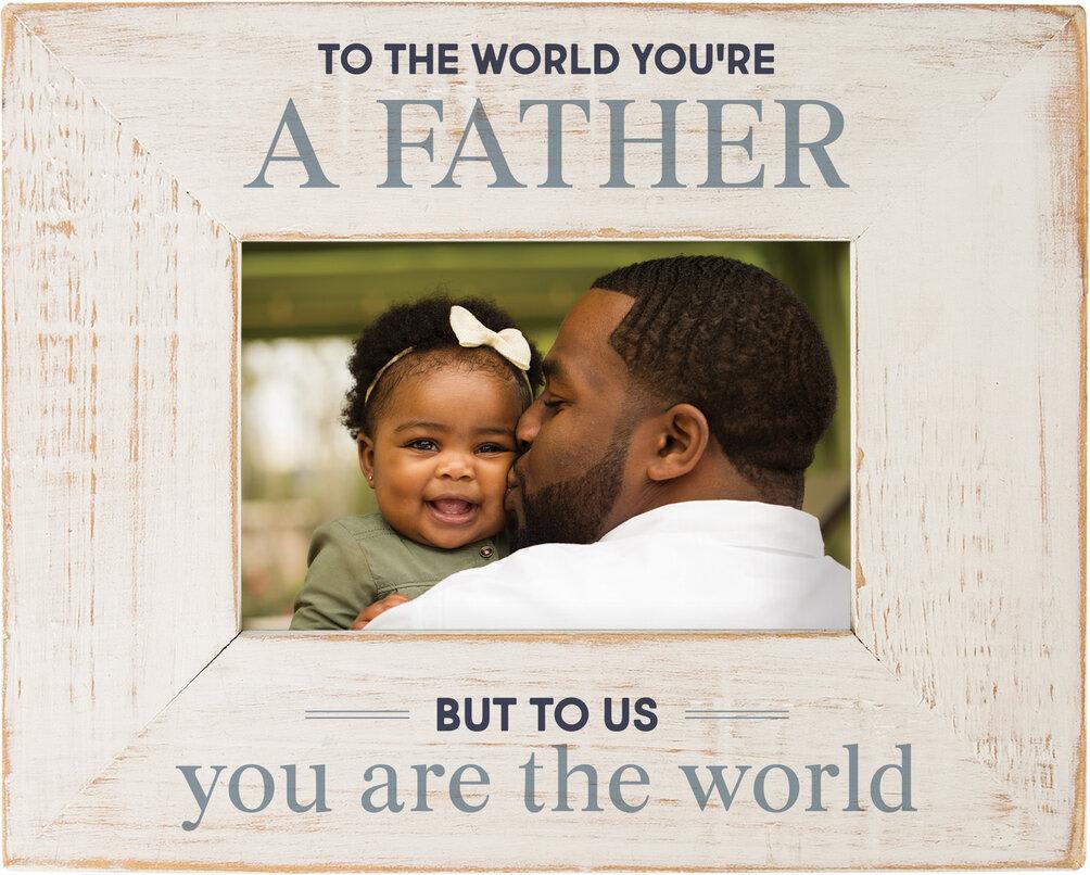 To The World You're a Father Frame - Life is full of precious moments worth remembering - weddings, vacations, get togethers, and more. This frame accentuates these memories by pairing photos with artistic embellishments and a lasting sentiment.  Size: 10&quot;W x 7.75&quot;H x 0.5&quot;D