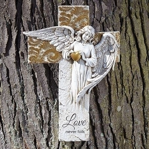 Roman angel on Cross with Gold - Resin 12&quot; x 8 1/2&quot;. Cross has saying &quot;Love Never Fails&quot;