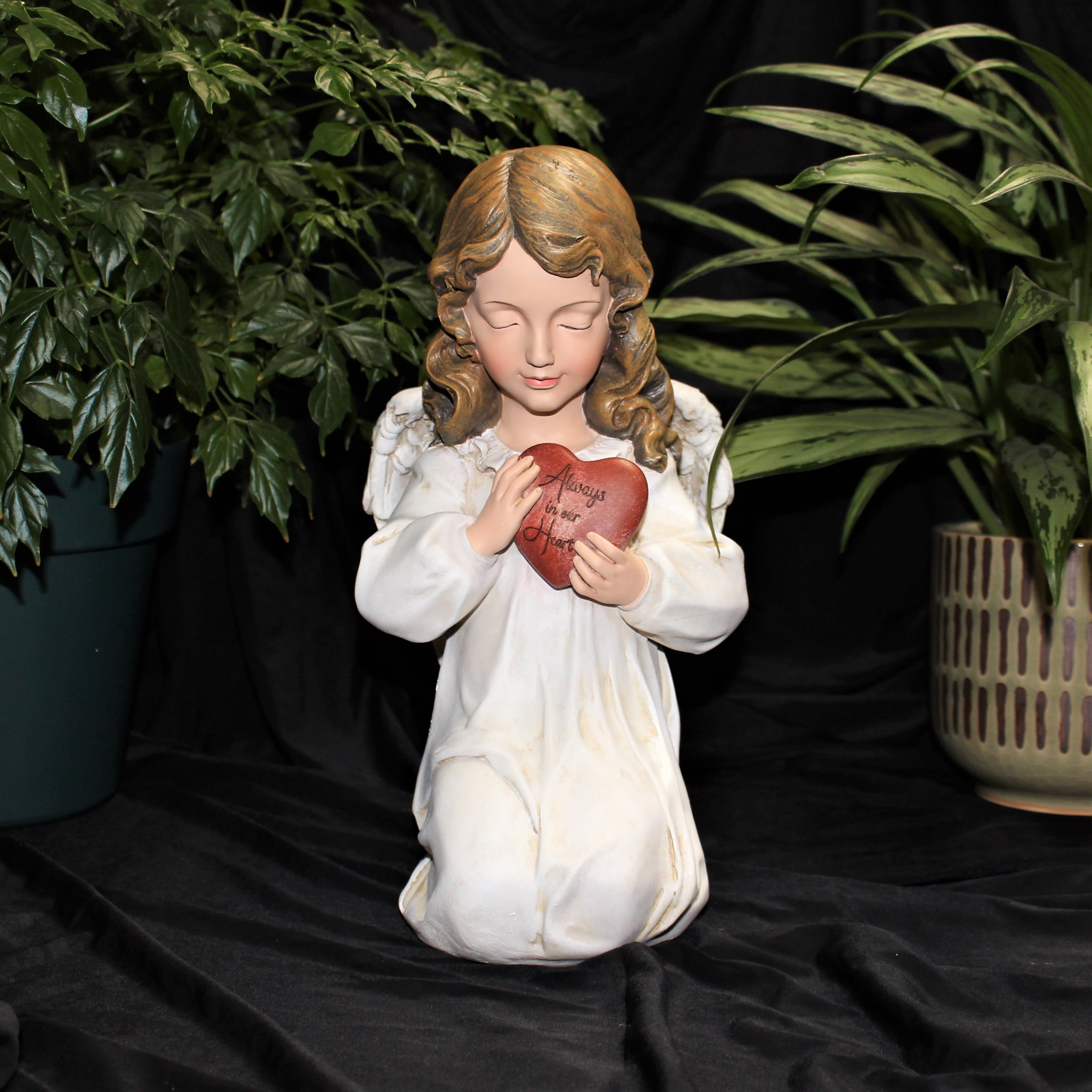 Roman Memorial with heart - Resin 11 3/4&quot; x 6 1/4&quot;. Angel holds a heart printed with saying&quot; Always in our Hearts&quot;