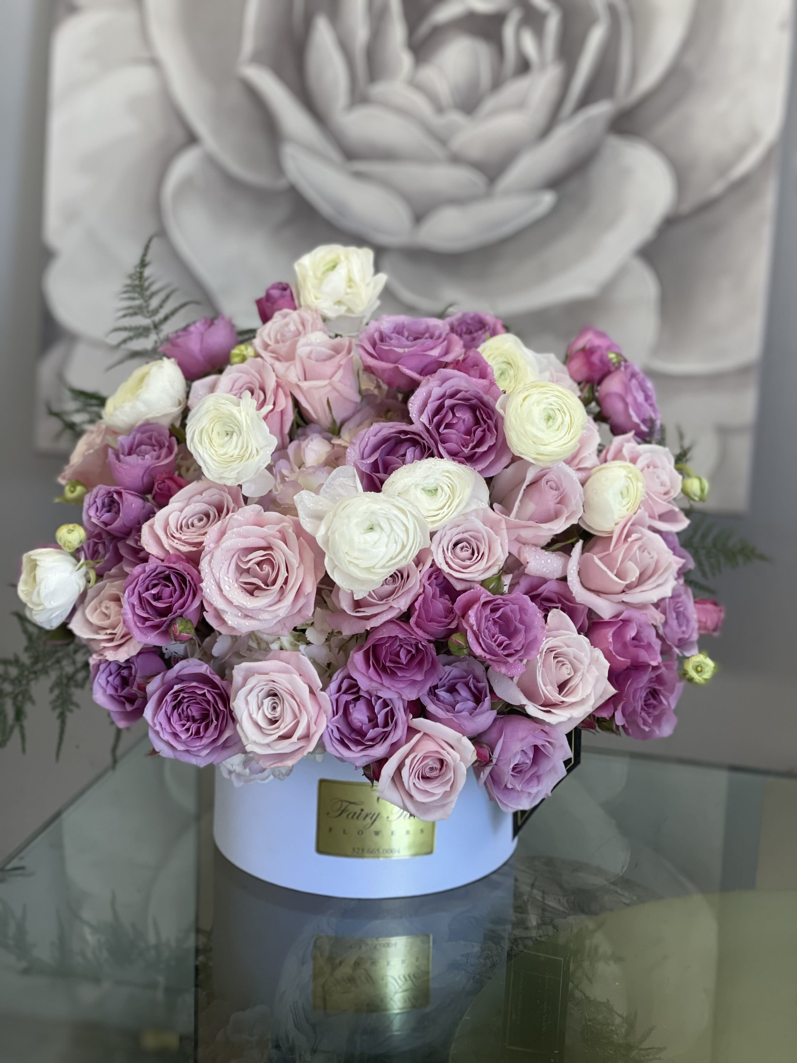 Purple Garden - Fresh arrangement with roses, spray roses, Hydrengias and renunculus.