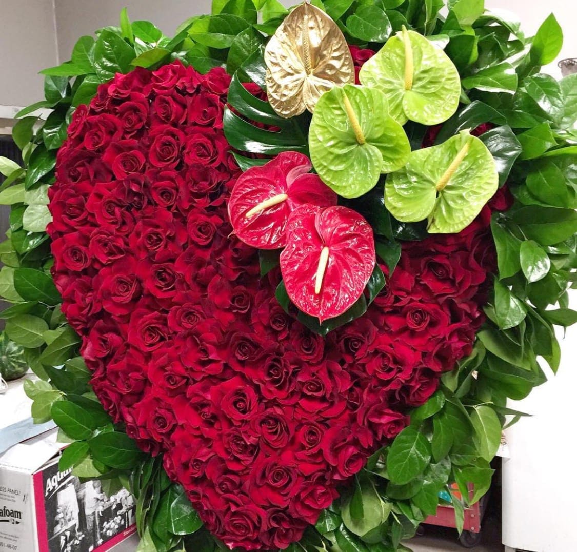 Forever in my heart - An exquisite heart arrangement with beautiful red roses. With tropical anthuriums added for elegance and beauty.