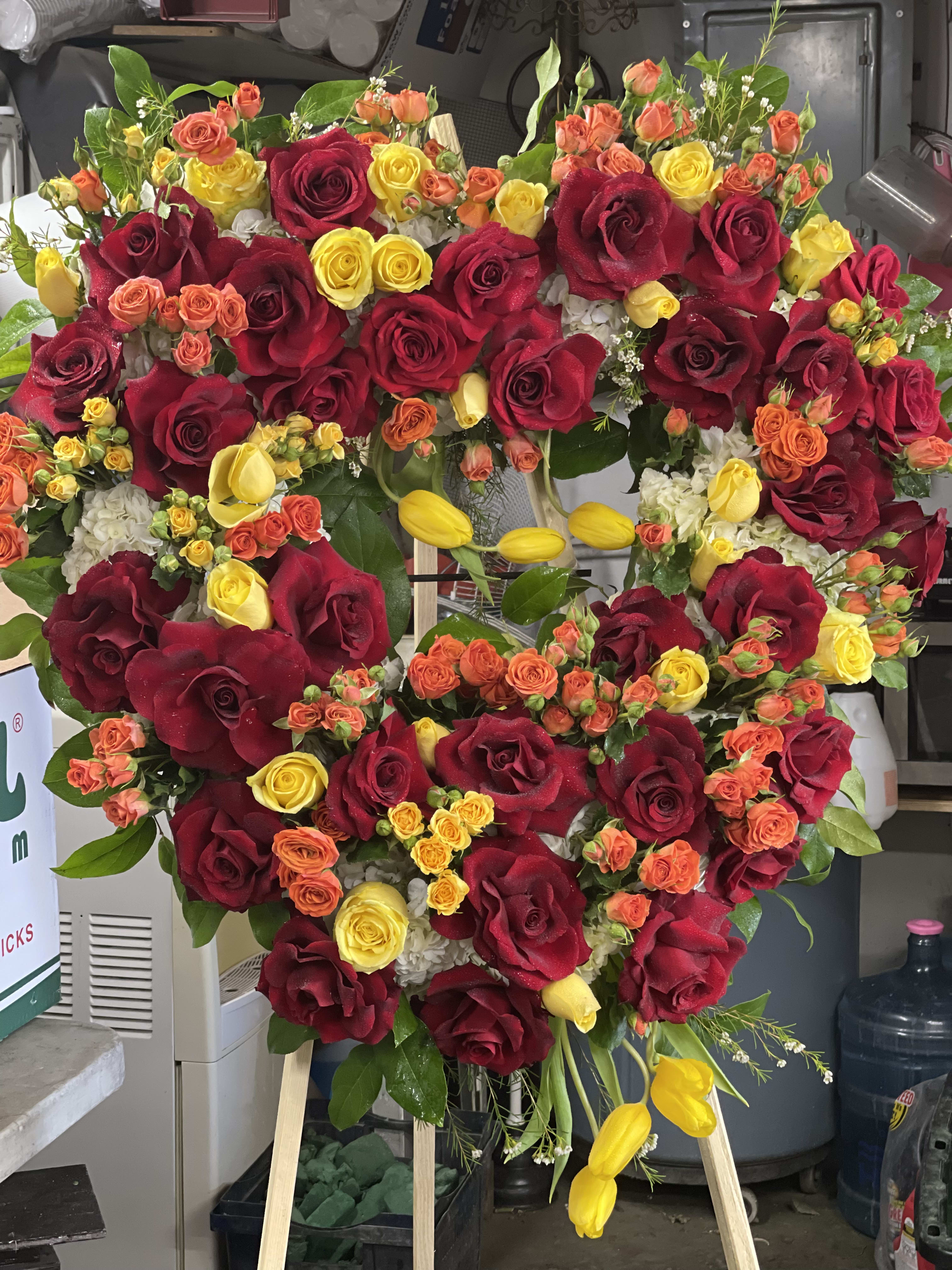 Color of love - A beautiful heart shaped arrangement  full of roses spray noses and tulips