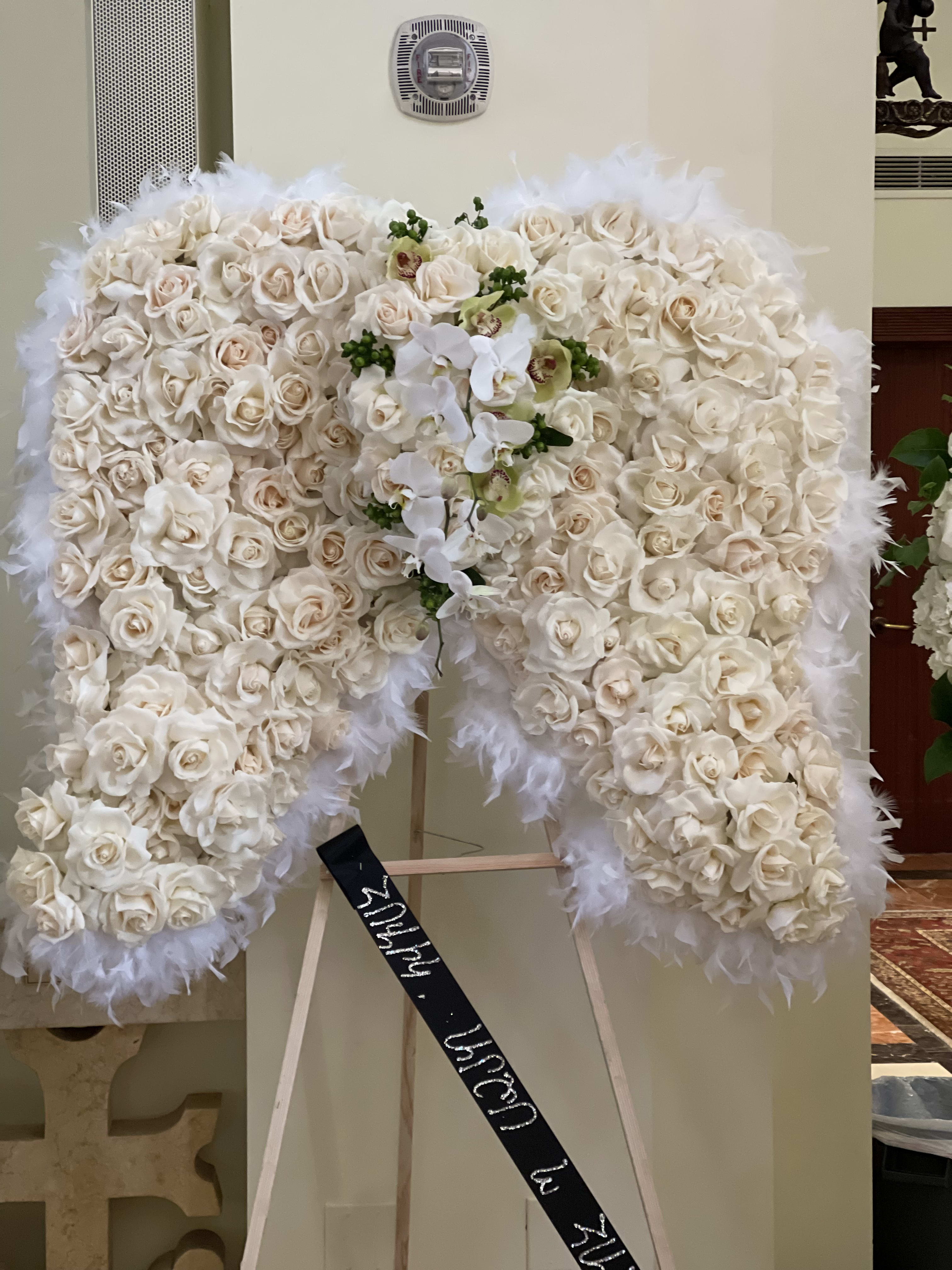 Heavenly angel - A big angel wing arrangement full of white roses
