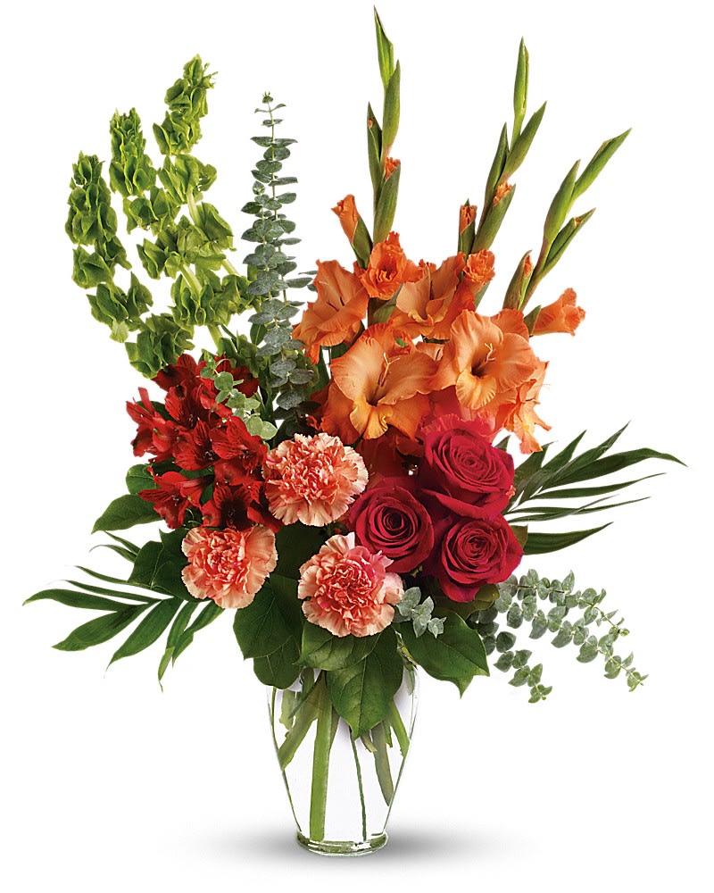 Days of Sunshine Bouquet - Red roses, red alstroemeria and orange gladioli in a sparkling Ming urn - a lovely tribute that sends a message of hope and healing for those mourning their loss. The brilliant arrangement includes red roses, red alstroemeria, orange gladioli, orange carnations and bells of Ireland, accented with assorted greenery. Delivered in a clear glass Ming urn.