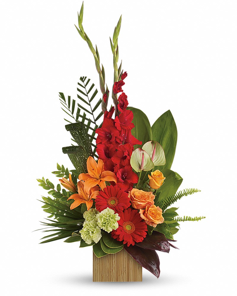 Heart's Companion Bouquet by Teleflora - A reminder of the joy of life, this stunning arrangement of orange and red floral favorites in a stylish bamboo cube is a gift that will be loved - and remembered. The opulent bouquet includes orange roses, orange asiatic lilies, green anthuriums, red gerberas, red gladioli and green carnations, accented with assorted greenery. Delivered in a large bamboo cube.