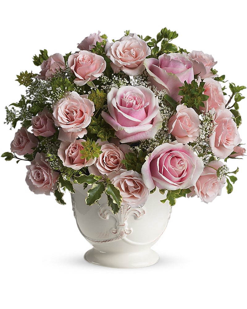 Teleflora's Parisian Pinks with Roses Teleflora's Parisian Pinks with Roses - Named after the most romantic city in the world, this pretty rose arrangement delivers romance ever so beautifully. Light pink roses symbolize femininity, elegance and refinement, especially when they are perfectly arranged in a white French country pot. Enchanting light pink roses and spray roses arranged with delicate Queen Anne's lace and greens are delivered in an exclusive ceramic container. C'est magnifique!