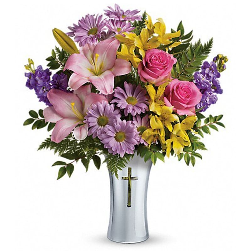 Teleflora's Bright Life Bouquet Teleflora's Bright Life Bouquet - Show them how much you care with this beautifully bright yet reverent arrangement of roses, lilies and alstroemeria. Gracefully presented in a shining, silver-finished ceramic vase with cross cut-out - a touching tribute to a bright life. This glorious arrangement includes hot pink roses, pink asiatic lilies, yellow alstroemeria, lavender stock, lavender daisy spray chrysanthemums, huckleberry and leatherleaf fern. Delivered in a Shining Cross vase. Orientation: One-Sided All prices in USD ($) Standard T278-2A Deluxe T278-2B Premium T278-2C