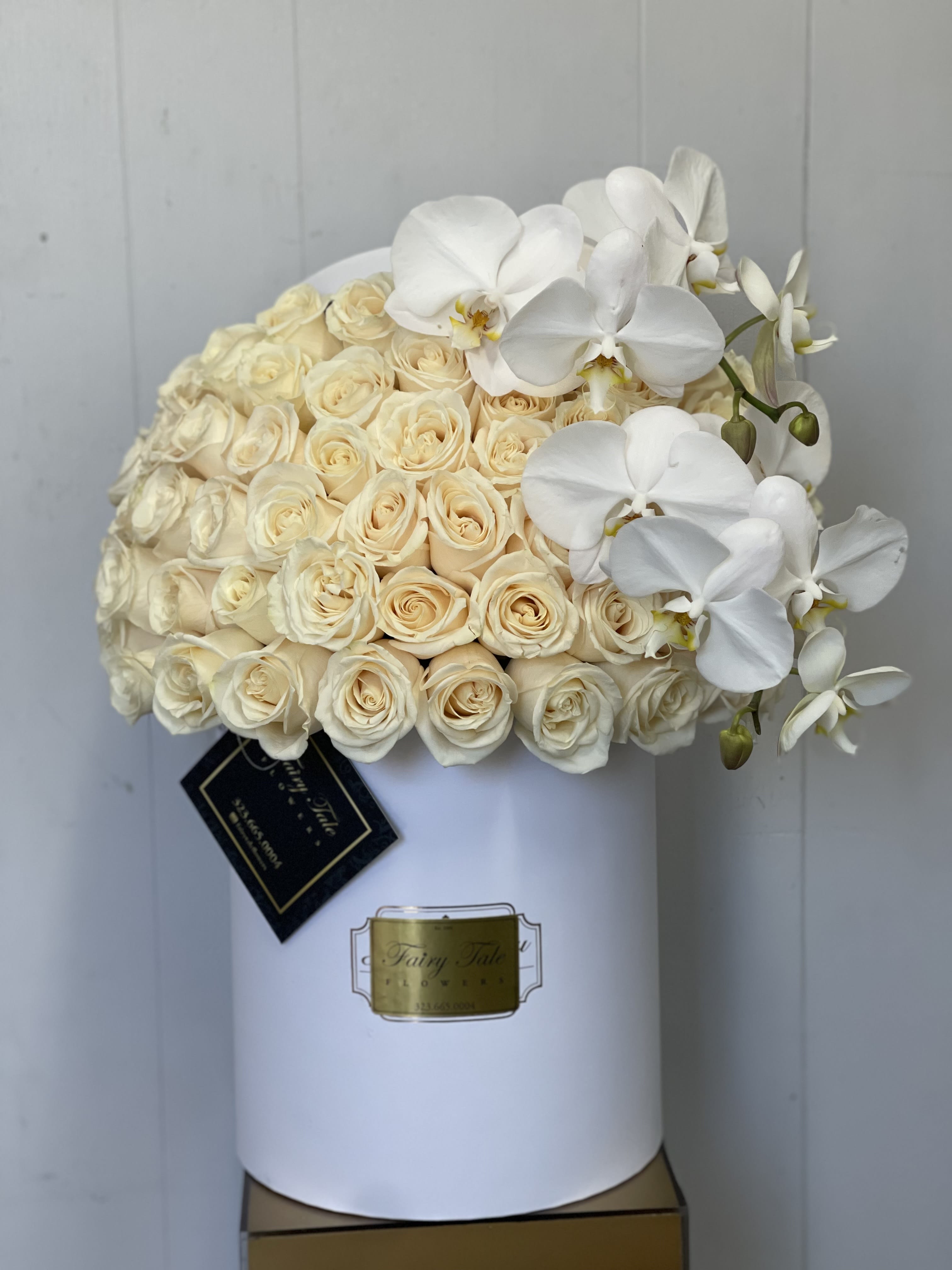 White Heaven - An elegant box of 50 white roses and beautiful orchids 