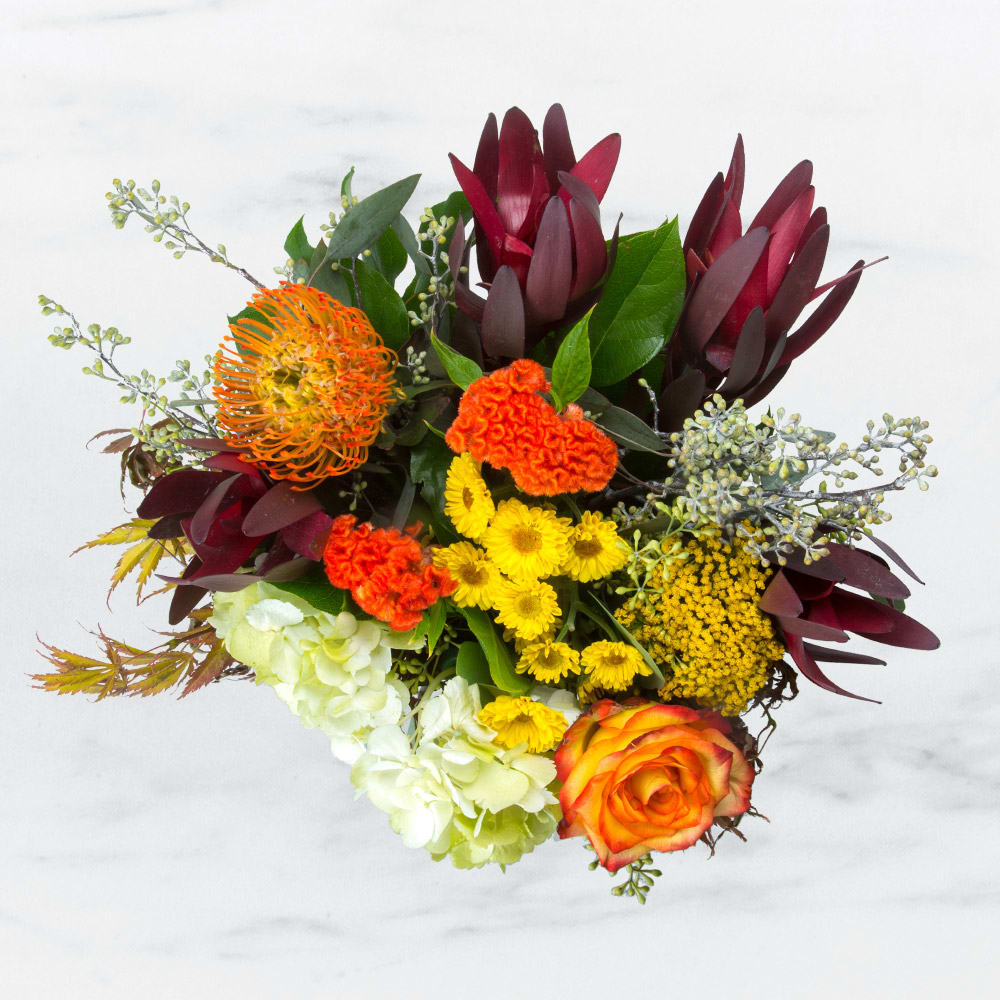 Happiness by BloomNation™ - This arrangement likes two things: being inside of a box and delivering happiness in the form of fall flowers. And it’s already inside of a box. Do this arrangement a favor and let it deliver happiness to someone. Order one today! 