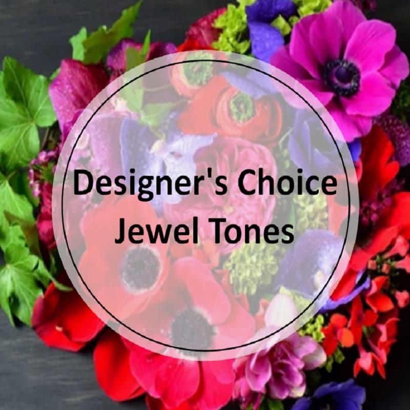 Premium - Designer's Choice - Jewel Tones - Bold, vibrant and rich colors.  The types of premium flowers used will vary based on the time of season and availability of specific flowers and greens.. Let our designers create a special and unique arrangement that goes above and beyond! 