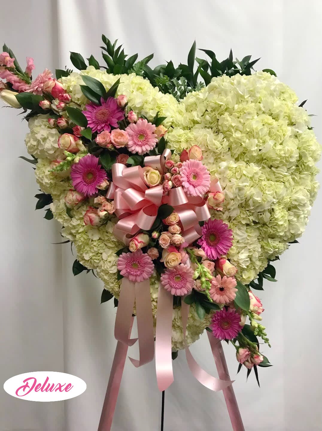 Pink Heart Pink Heart - Sweet pinks and whites. This heart is beautiful with all white Carnations and a full break of all pink flowers.