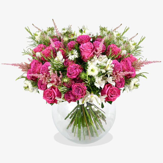 Sweet Treat Bouquet - This playful and bright colour palette creates the basis for this enchanting bouquet. Fuchsia spray roses with hot pink roses and pink astilbe establish this fun and feminine design. Wilder in style but elegant as ever, this design is contrasted with dainty white alstroemeria and nigella white to form a dreamy display. Finished with lightly fragrant rosemary and seasonal greenery, this bouquet makes for a lovely gift for a friend or loved one with its romantic yet youthful charm.