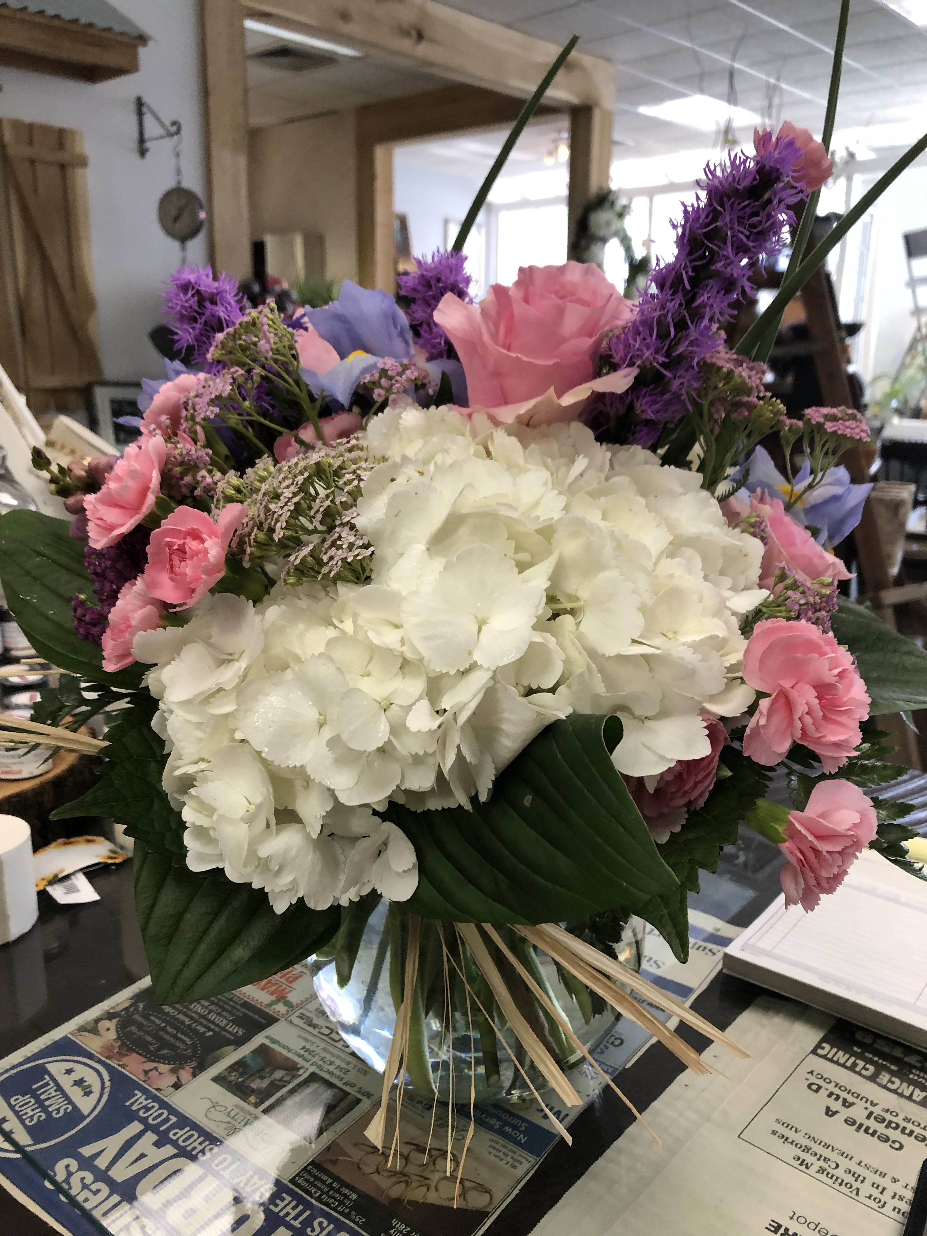 Loving you! Loving you! - White hydrangeas, pink mini carn sprays, purple liatris and iris make this arrangement loving you easy.