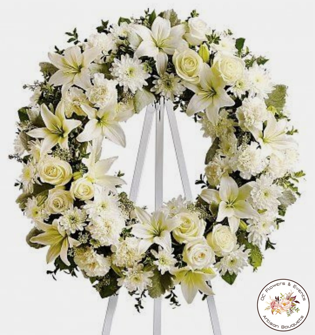 White Serenity Round - Beverly Hills - Beautiful, peaceful white wreath of White Roses, White Lilly, White Daisies, and a touch of greenery.