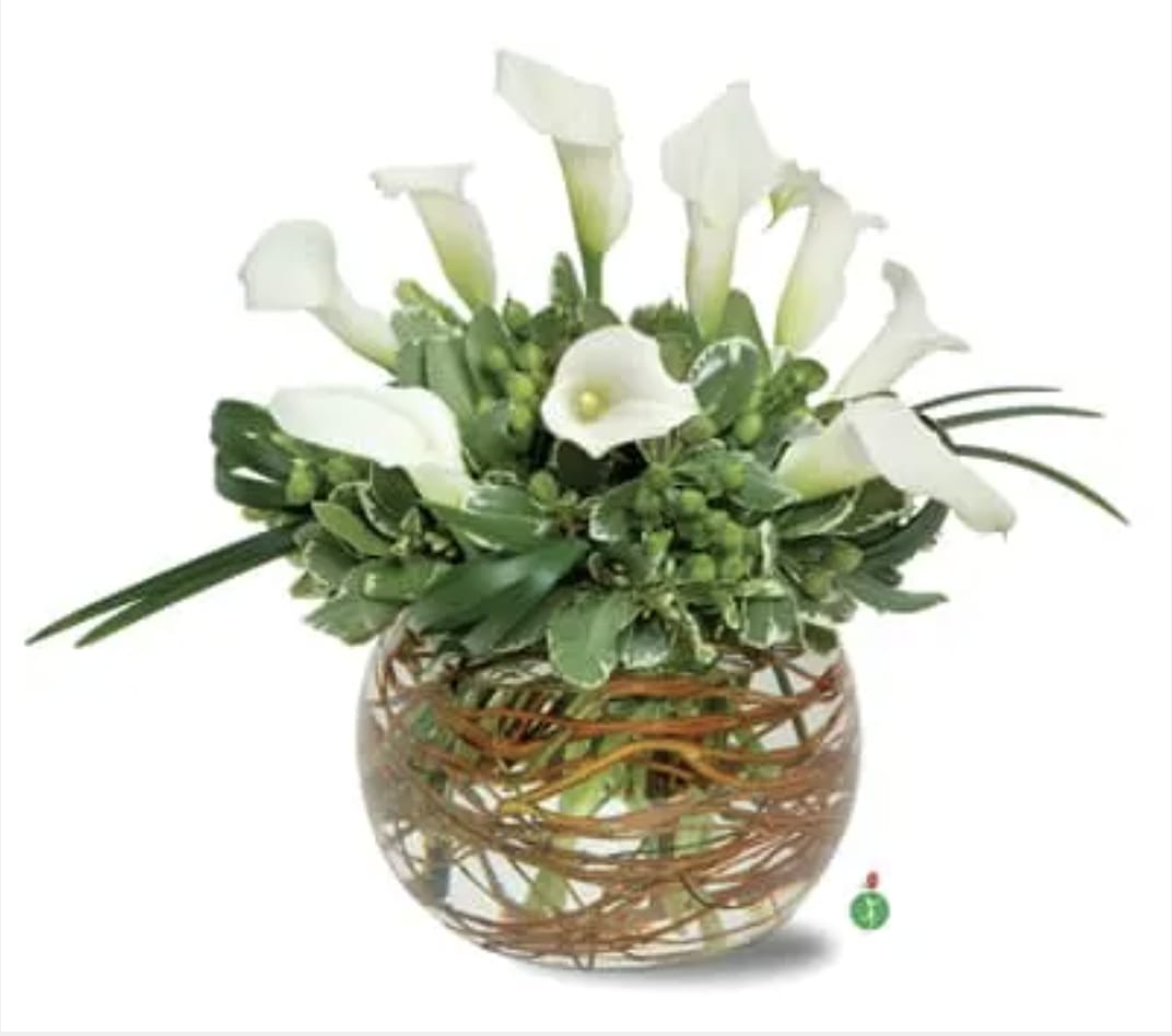 Calla Lily Bowl - For a truly original gift, choose this glass bubble bowl lined with vines and topped with an eye-catching arrangement of pure white calla lilies, hypericum berries and greenery. It’s a unique design that’s sure to capture their attention.