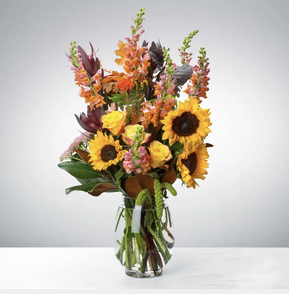 Hello Fall by BloomNation™ - Say hello to the new season with this tower of fall flowers! Featuring a wide array of seasonal blooms, this arrangement has something for everyone, and is sure to bedazzle whoever welcomes it into their life. Say “hello” to someone in your life with this fall flower tower. 