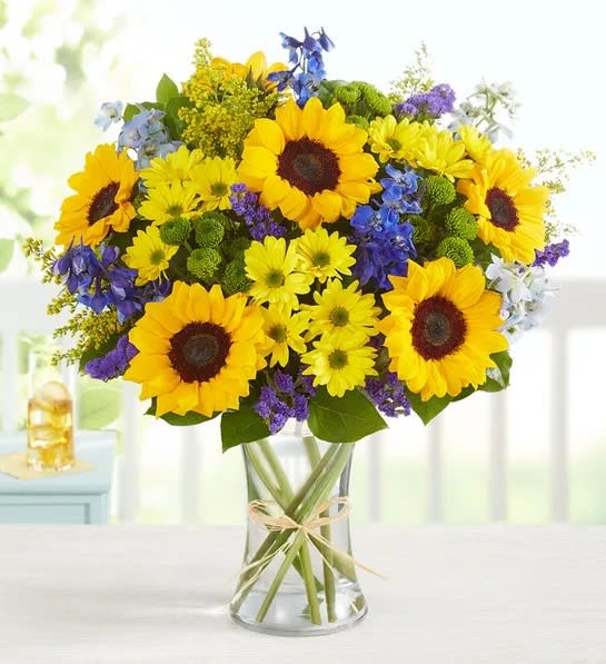 Fields Of Europe® Summer Fields Of Europe® Summer - Inspired by the colorful charm of the European countryside, our best-selling summer bouquet is gathered with fresh-picked blooms, revealing the rustic beauty of nature. Shades of golden yellow and rich blue pop against lush greenery, creating a timeless gift for someone special to enjoy.