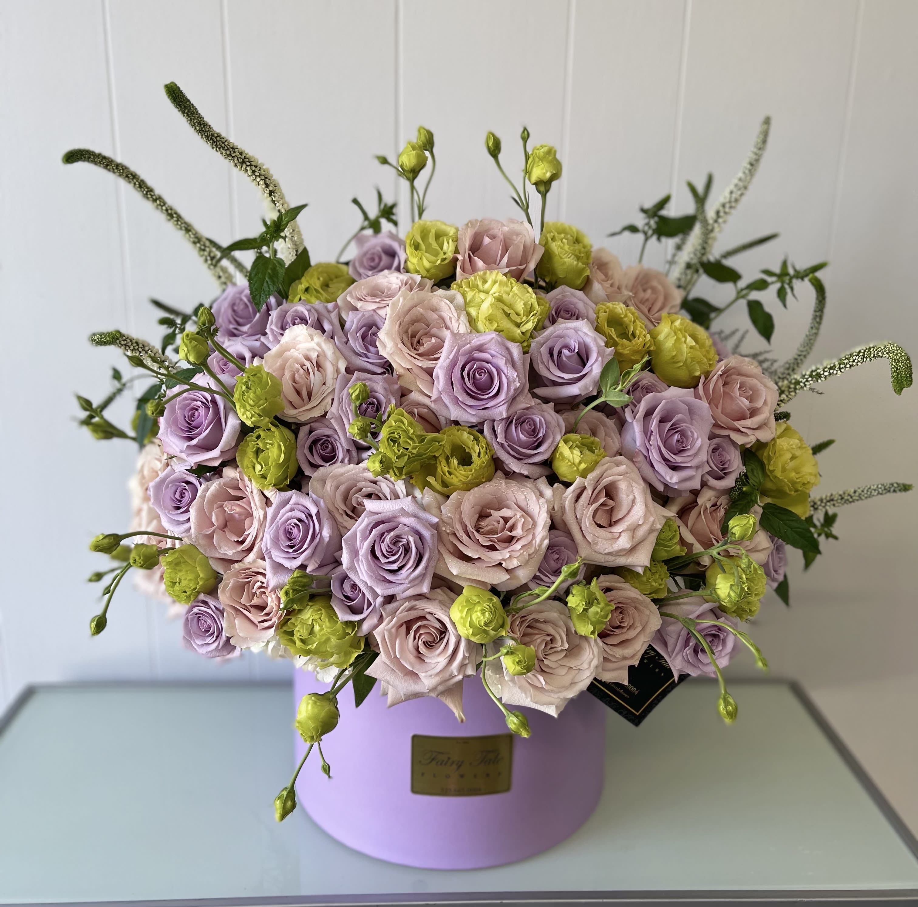 Lavender goddess  - Stunning arrangement of lavender roses and green lisianthus  in out lavender round box 
