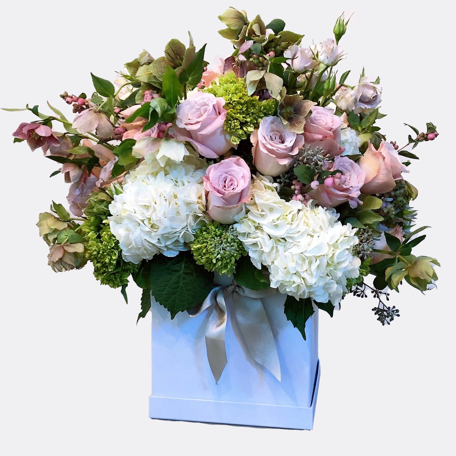 Adoration - This arrangement represents the harmony of one's feelings with their higher self. Featured flowers: Secret garden rose, Hydrangeas, Hydrangeas mini, Helleborus. Designed in Fleurs Et Fetes box.