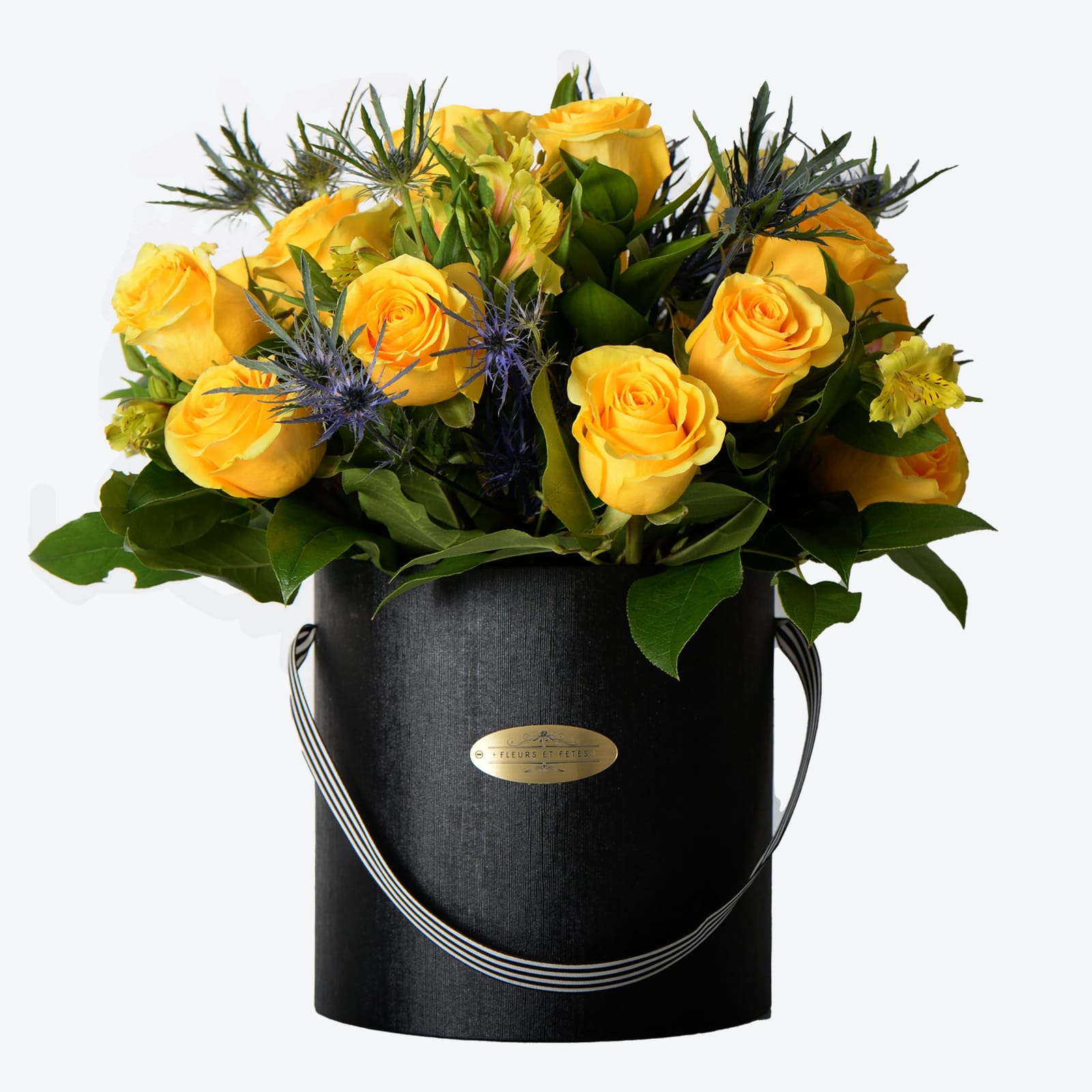 Enjoyment - Featuring fresh flowers. The happiest color in the spectrum, yellow is a friendly color that encourages communication. It also stimulates the memory and the nervous system. Designed in our signature box.  *Due to Covid-19, some flowers may not be available. Fleurs et Fetes reserves the right to adjust the flowers and color depending on availability*
