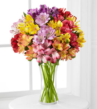 Bright Wishes - Peruvian Lilies in a vase with Greens. Sent this to brighten anyone's day, Send well wishes or welcome that new baby. Any occasion this is sure to please. 
