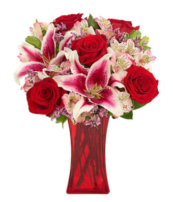 Forever Romance Bouquet - Listen...that's the sound of your special someone's heart skipping a beat as they behold this incredibly beautiful bouquet. Stargazer lilies, roses, alstroemeria and limonium blend wonderfully together in a gracious gathering vase to create the perfect expression of romance.
